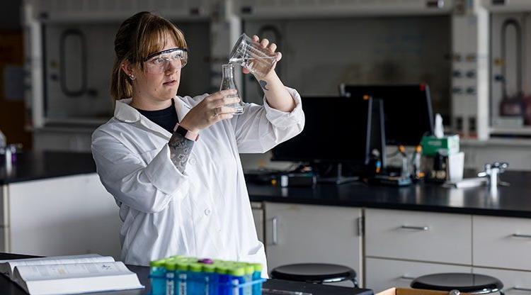 Student in a chemistry lab doing an experiment